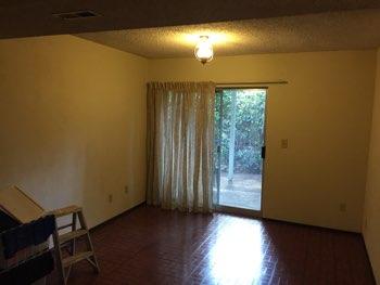 1. Family Room Basement Family Room Walls and ceilings appear in good condition overall.