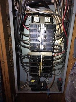 1. Location Materials: Located in the Garage Electrical 1 2. Electrical 200 AMP service, 4/0 Aluminum service entrance wires. Panel circuit breakers are not labeled and listed. 3.