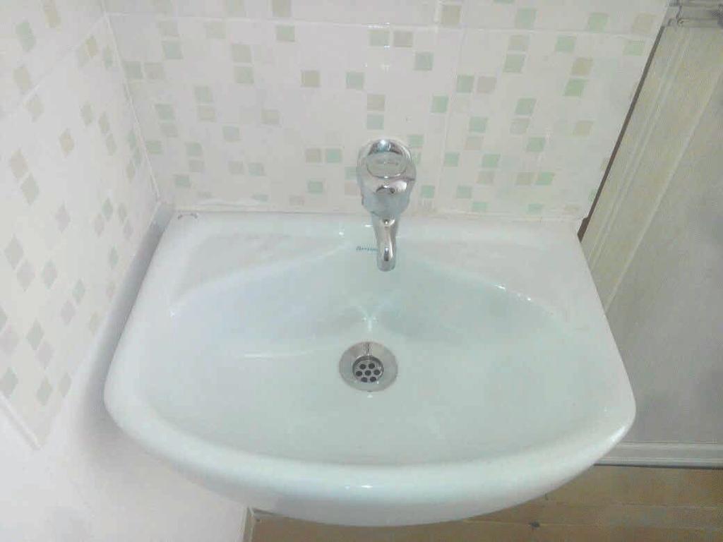 stainless steel sink Tiled dado above platform Provision for water purifier Provision for water