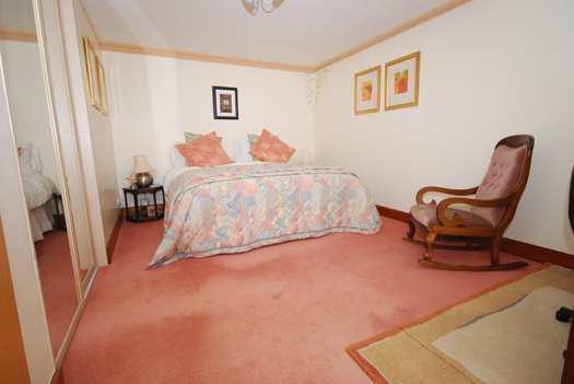 DOUBLE BEDROOM 2 17 ft x 10 ft 3 Twin cottage style windows to the front. Double mirror-fronted built-in wardrobes.