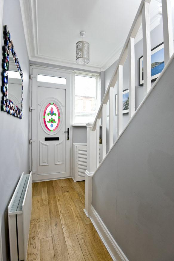 The Property Comprises: upvc front door with stained glass panel.