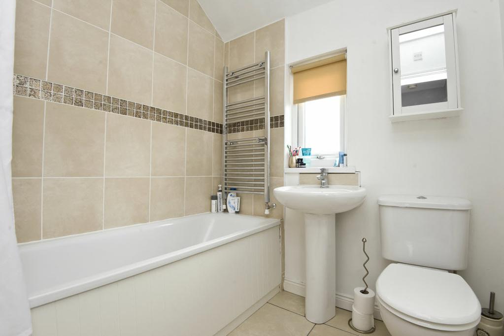 basin with chrome mixer tap and tiled splashback.