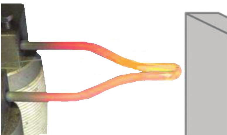 FIG. 3: Typical glow wire setup showing heated element glowing red/yellow in color. (Temperature set to 750 C).