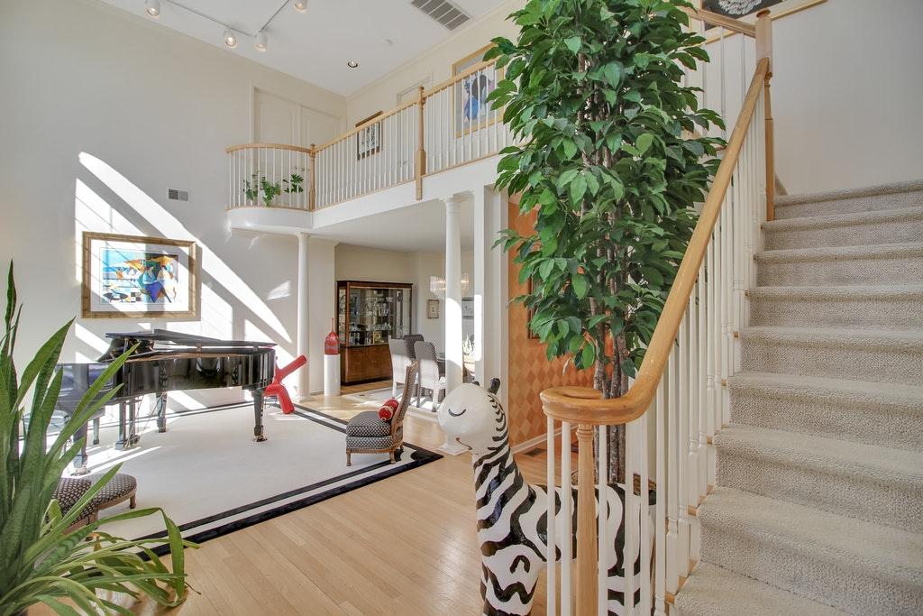 Foyer and Study: The impressive double height Foyer sets the tone for the elegant and welcoming Santa Barbara style of this