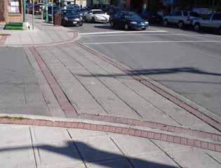 Guideline 22: Provide an unobstructed 2.0 metre wide sidewalk in the public right-of-way, across private access driveways.