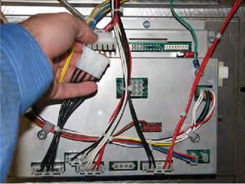 Place the new transformer on to the studs, and then use a 3/8 in. nut-driver to secure in place. 6. Reconnect the wires. 7. Install the control board by performing the installation procedure from 11.