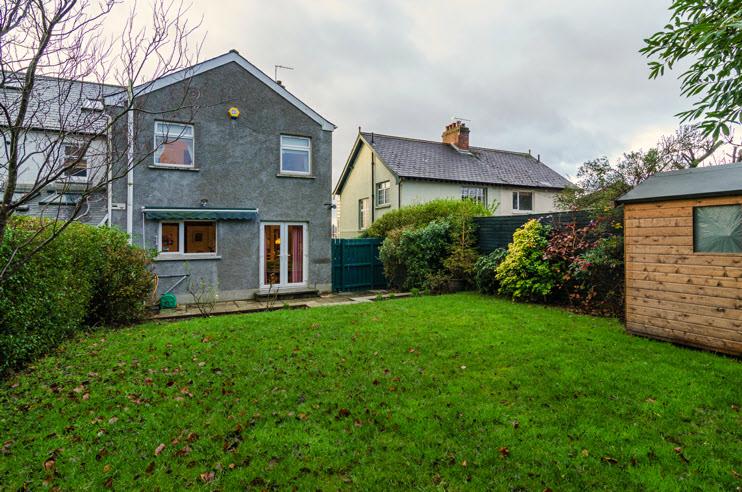 Pink pebble driveway to parking. enclosed, well-maintained rear gardens in lawns bounded by fencing & hedging, large paved patio. Boiler House; oil fired boiler. Outside light & tap.
