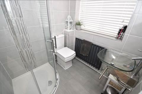 QUALITY FITTED EN-SUITE SHOWER ROOM 5 7 x 5 5 Open roofed and tiled in quality porcelain with quartz vertical borders and contemporary