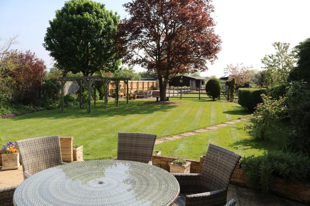 Rear Garden The rear garden has a paved terrace with alfresco entertaining area overlooking the main lawn where there are stepping-stones to the paddock.