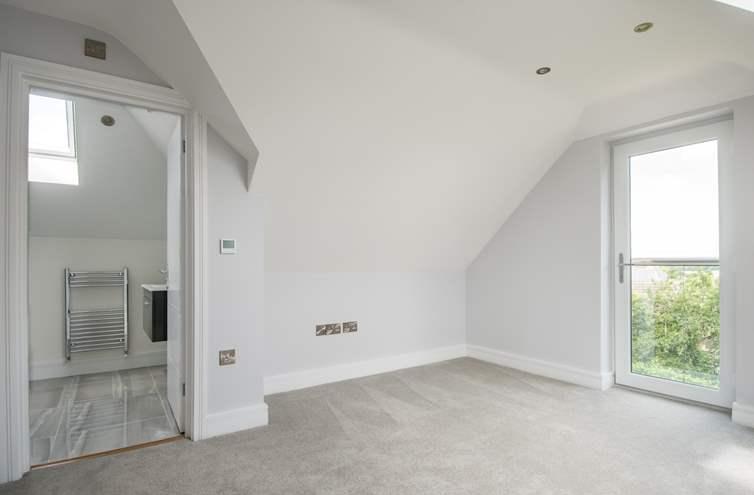space. In addition, there is a spacious 20ft triple aspect living room, utility room, useful walk-in pantry and ground floor cloakroom.