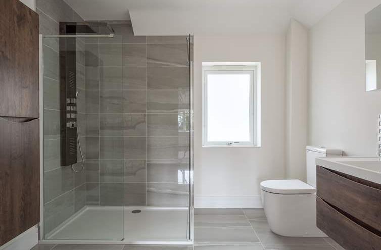 EN-SUITE SHOWER ROOM EN-SUITE SHOWER ROOM 9' 0" x 8' 0" (2.74m x 2.44m) Opaque double glazed window to front aspect.