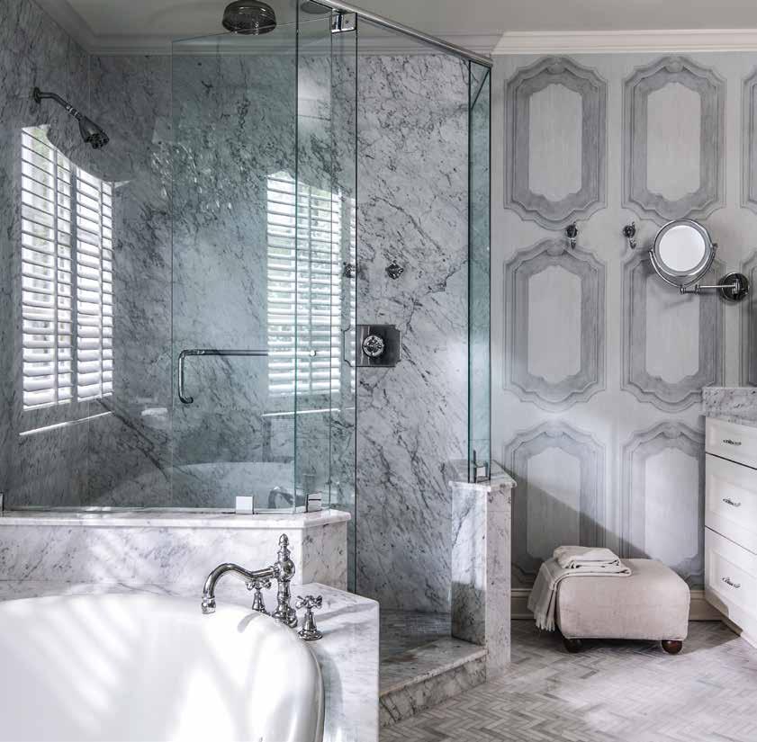 Left: A marble, herringbone floor, provided by Best Tile, serves as the backdrop for the oasis that is the master bathroom.