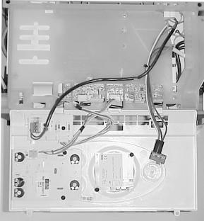 Lower the control panel, refer to Section Routine cleaning and inspection. Unclip control panel user interface and hinge forward. Do not strain the cables.