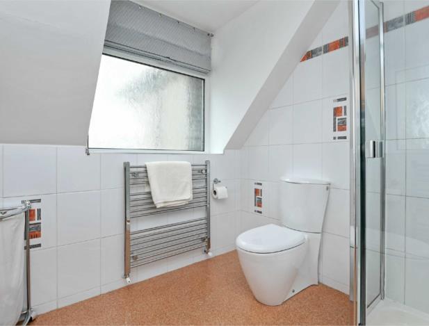 fitted wardrobe, cupboards and drawers SHOWER ROOM 8' X 7'4'' (244m X 224m ) With a frosted PVCu double glazed window, inset LED downlighters, floor to ceiling tiled walls, chrome ladder style heated