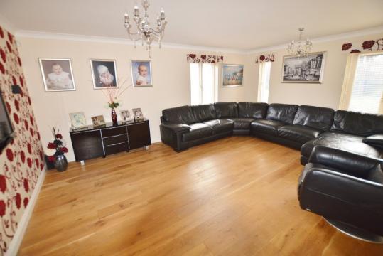 The property features entrance hallway, family room, living room, downstairs cloakroom/wc, utility room, integral double garage, fitted dining kitchen, stairs to first floor landing, si x bedrooms,