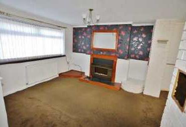 65m) Central heating radiator. Fireplace with electric fire. Opening through to dining area.