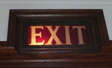 The exit signs should be replaced or retrofitted with LED lamps. Energy use will decrease from 50 watts to 3 watts.