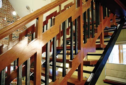 steel balusters, connected to a Tudor style cherry wood