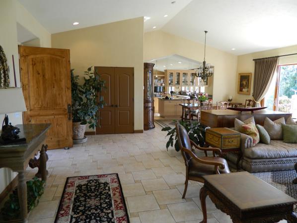 MAIN RESIDENCE: You enter into a 1,100 sq/ft Great Room that is all glass French Doors on the South side