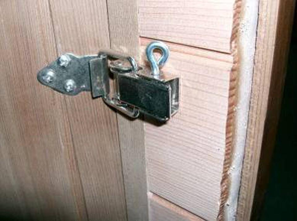 Put the metal pins in the latches to lock