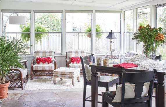 The sunroom s traditional elements present an agreeable contrast to the adjoining great room.