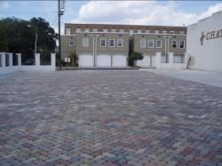 Permeable pavements represent an alternative to traditional impervious paving surfaces. They typically consist of an underlying drainage layer and an overlying permeable surface layer.