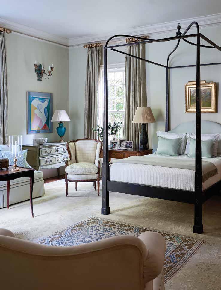 The walls of the master bedroom are a strié in pale green, the perfect backdrop for a custom chinoisserie bed.