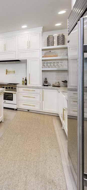 RIGHT The pantry s shelving and cabinets hold a wine refrigerator and storage space for the family s bulk purchases. Counters are from Ikea.