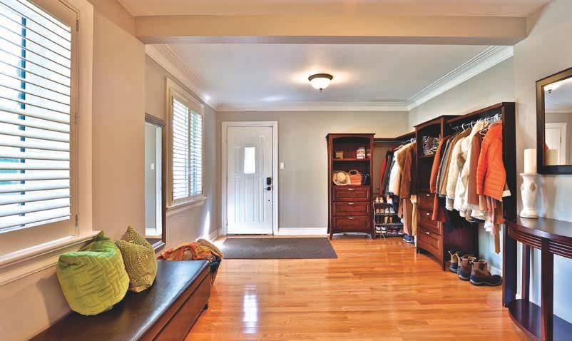 shutters Overlooks side gardens Main Floor Laundry Room Ceramic tile floor Custom cabinetry and shelving Deep industrial sink Access to back staircase Overlooks