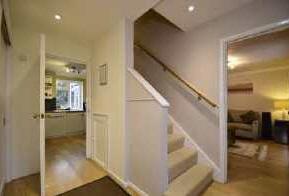 In addition the box bay window to the front is a charming feature. Behind the stairs the kitchen is impressive. Fitted with a wide range of units it is modern and attractive.