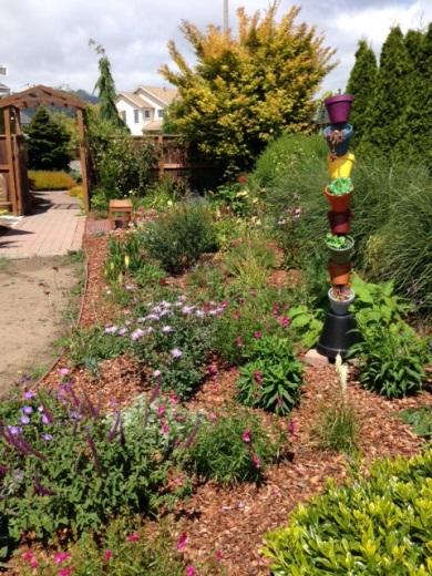 It is a garden with elements that reflect what make a garden healthy and enjoyable for people and plants alike engaging our senses and sense of place, enticing