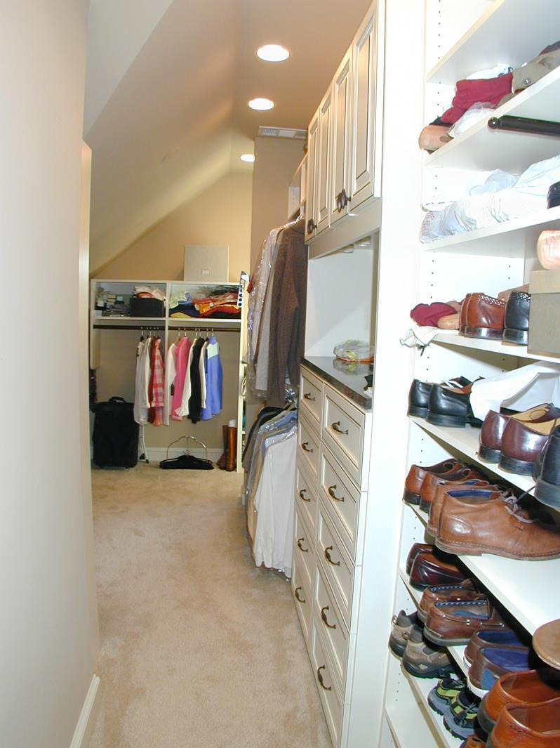 Shoe racks, plenty of drawers arranged like a dresser.
