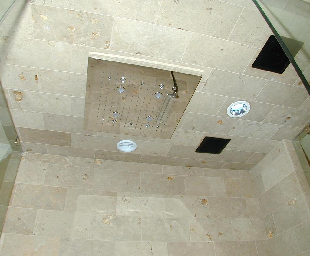 Features a large ceiling mounted shower head. The unit has Rainfall, Cascade, and Mist water functions.