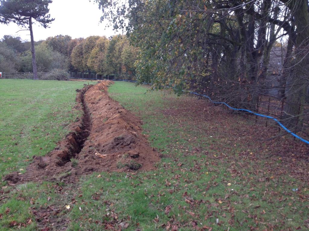 At the Station Road end of the pipe, stratigraphy was 20cm of topsoil, 45cm of light brown silty clay, and 10cm of slightly cleaner silty brown clay to trench bottom.