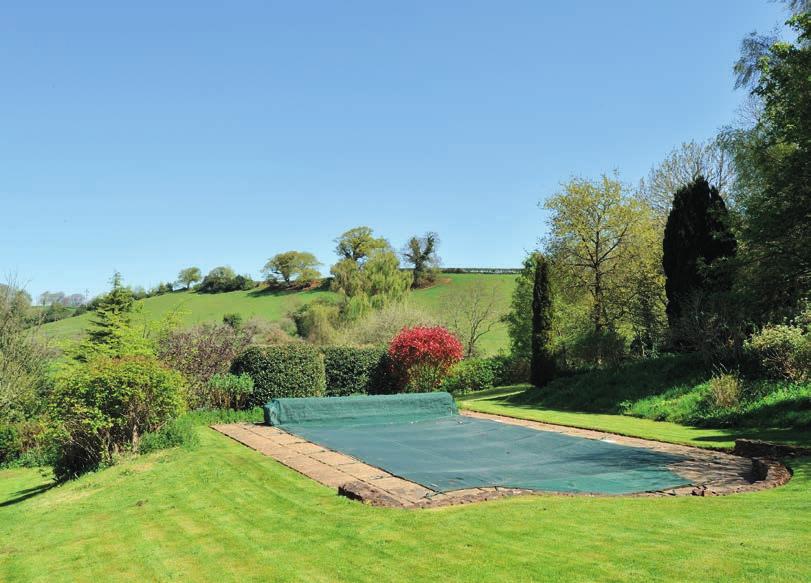 A delightful garden lies immediately to the rear of the house on a slightly higher level and is surrounded by well-stocked herbaceous borders with a path leading around to a