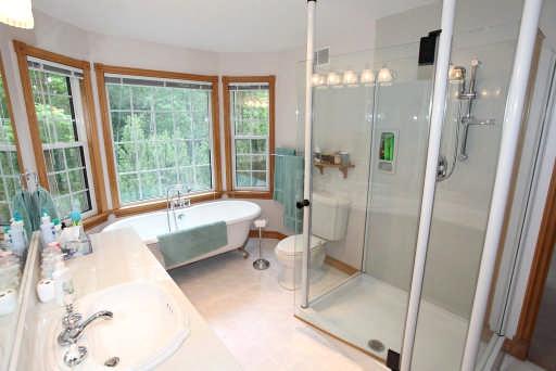 Bathroom 4 piece - Oak vanity with vessel style sink and vanity lighting -
