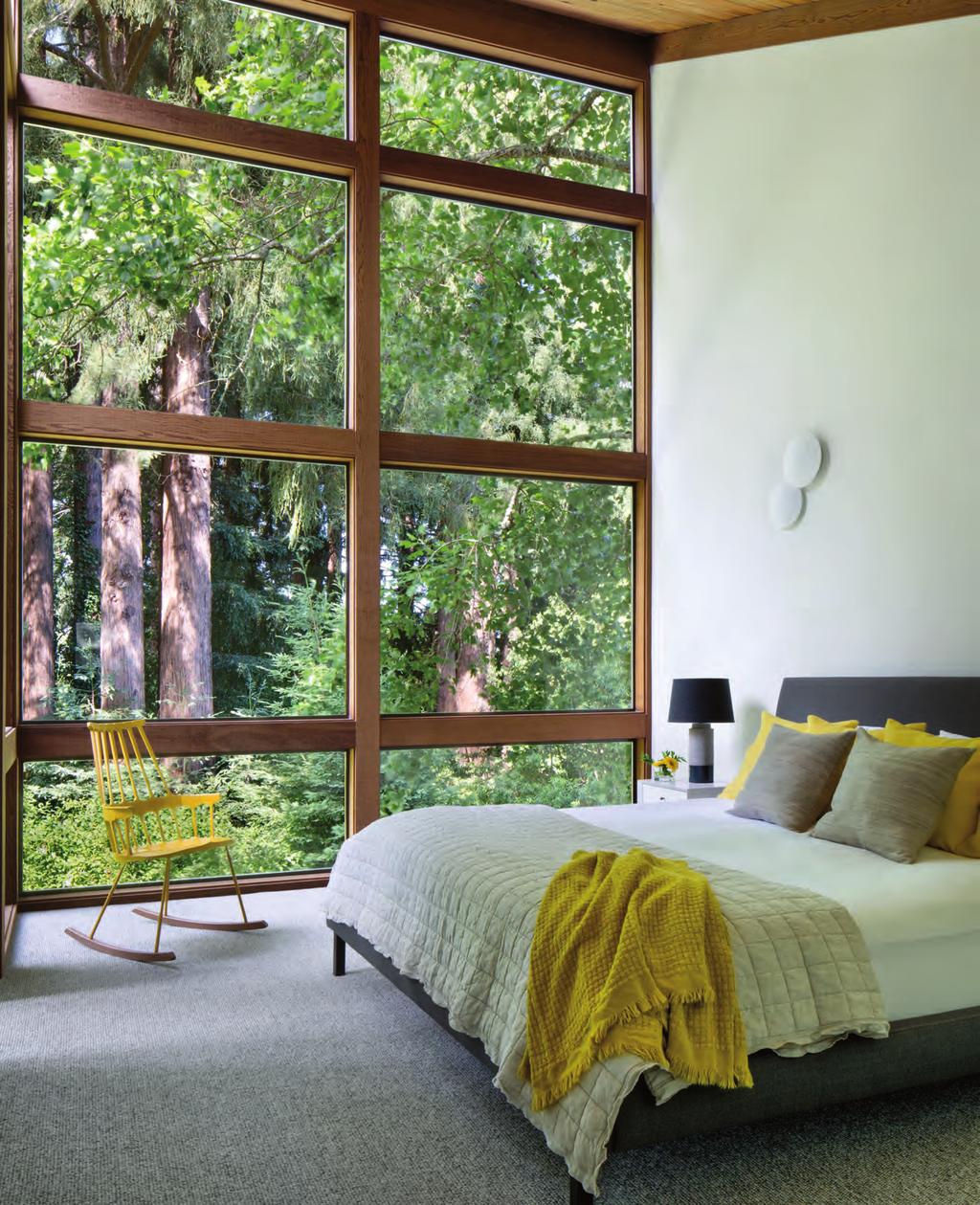 Below, left: The guest bathroom features the same leafy views as the guest bedroom.