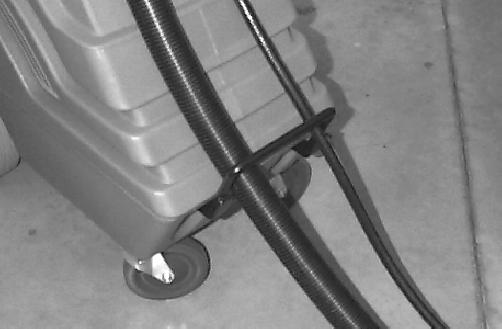 Connect vacuum hose to recovery dome and solution hose to quick coupler located in front of handle (Figure 3). FIG.