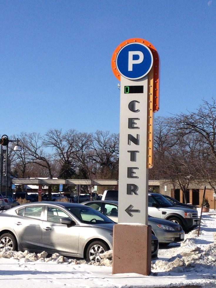 real-time parking availability, between the District s three parking ramps and a series of directional and wayfinding signs throughout the District.