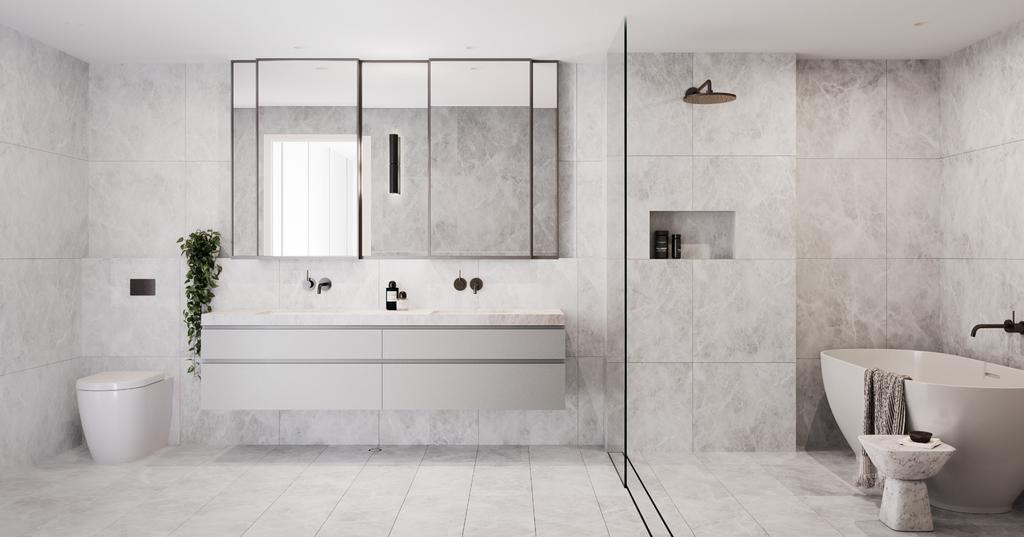 TRANQUIL RETREAT Dressed in luxurious stone, beautiful bathrooms have been designed to calm the senses, featuring double vanities, large mirrors and freestanding baths, softly finished with elegant