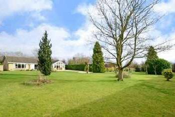 A large, very well proportioned, three double bedroom detached bungalow set in beautiful landscaped grounds of approximately an acre with stunning southerly aspect.