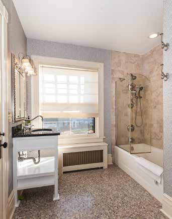 Bathroom #2 with tile floor, sink with granite countertop over custom vanity, Toto commode, Kohler shower over tub,