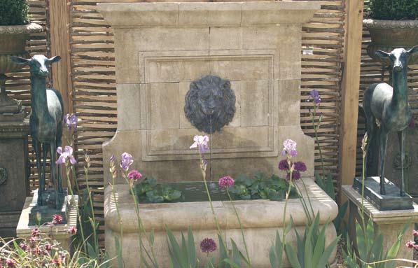 The Onslow Park Wall Fountain with Lead Lion Mask [item 14] A hand carved natural limestone wall fountain having lead lion mask spout centred to the classical back plate.