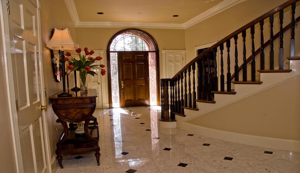 Main Level Foyer: Upon entering you immediately are drawn to the curved staircase that appears to be floating above the