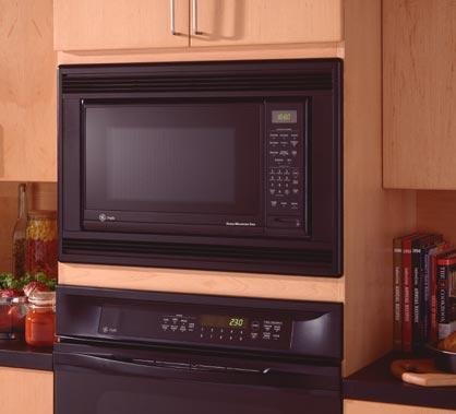 THIS OVEN CAN SET A COUNTERTOP FREE A countertop microwave oven can be hung from your cabinet or built into your wall (above) freeing up valuable counter space.