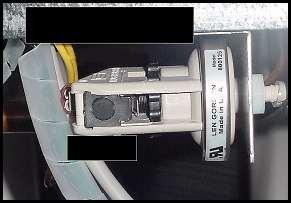 Len Gordon Switch: 1) Locate black rectangular plastic tab, located on forward-facing side of the switch. See Figure 22. The black rectangle is a wheel lock tab.
