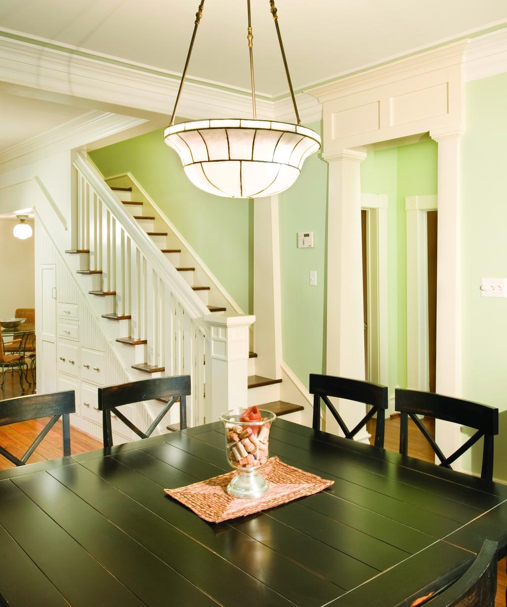 A soothing green wall color was pre-existing when Wendy first purchased the home and was so pleasing the Parkers opted to keep it and extend it up the stairway.