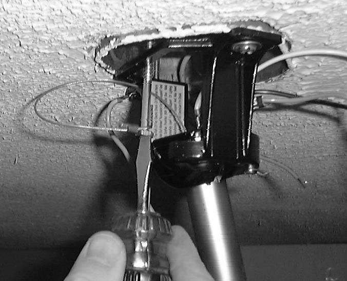 previous step. Make sure the fan is hanging straight. Rotate fan until the tab on the Mounting bracket engages the slot on the Downrod Ball.