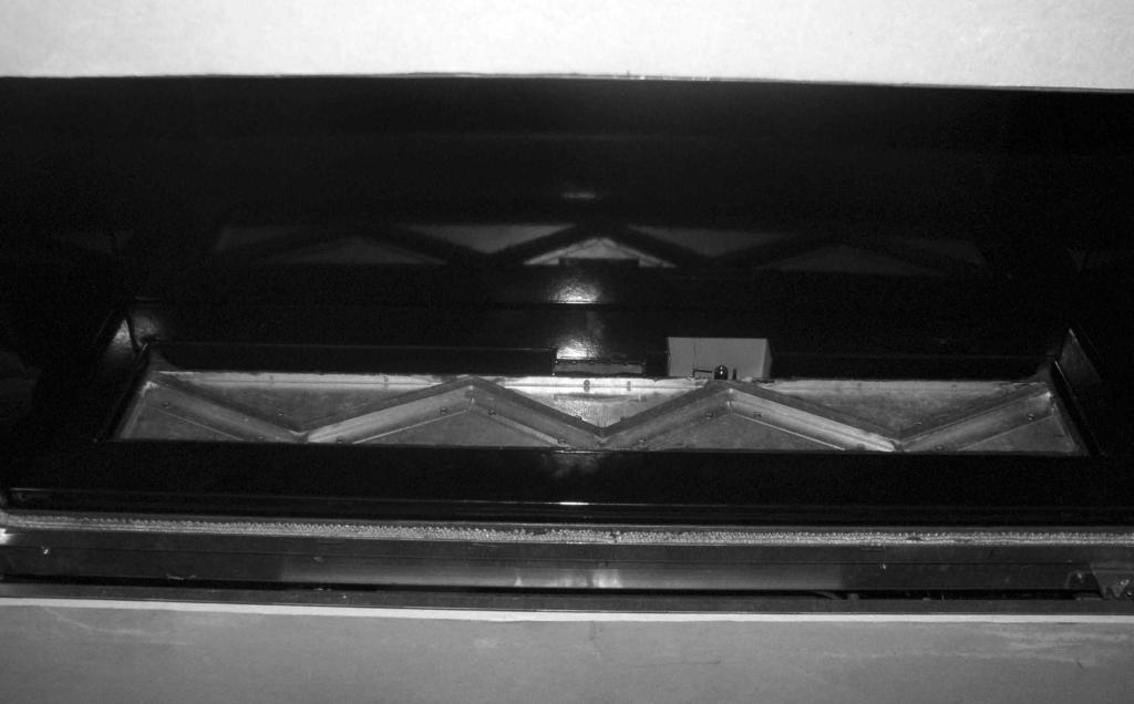 2.8 REMOVING THE BURNER ASSEMBLY a) Lift the burner tray cover vertically clear as shown