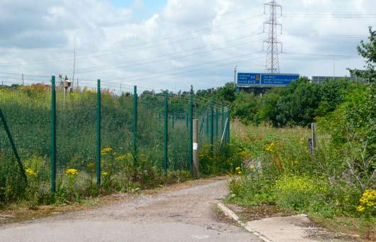The land is surrounded by roads and industrial uses to the north, east and south, including the A4, M25 and M4, together with the Lakeside Industrial Estate, the Sewage Works and the Grundon
